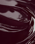 Close-up image of a highly concentrated black cherry liquid candle dye.