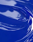 Close-up view of a highly concentrated blue liquid candle dye.