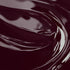 Close-up image of a highly concentrated black cherry liquid candle dye.
