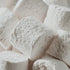 Close-up of white marshmallows with a soft focus background