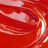 A close-up image of a red liquid candle dye.