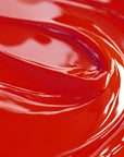 A close-up image of a red liquid candle dye.