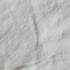 A close-up image of a white canvas texture, likely a fabric material.