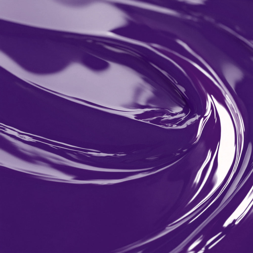 Close-up view of a highly concentrated purple liquid candle dye.