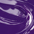 Close-up view of a highly concentrated purple liquid candle dye.