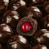 A close-up image of chocolate-covered cherries, with the focus on the cherry center, representing the fragrance oil product named 'Cordial Cherries'.