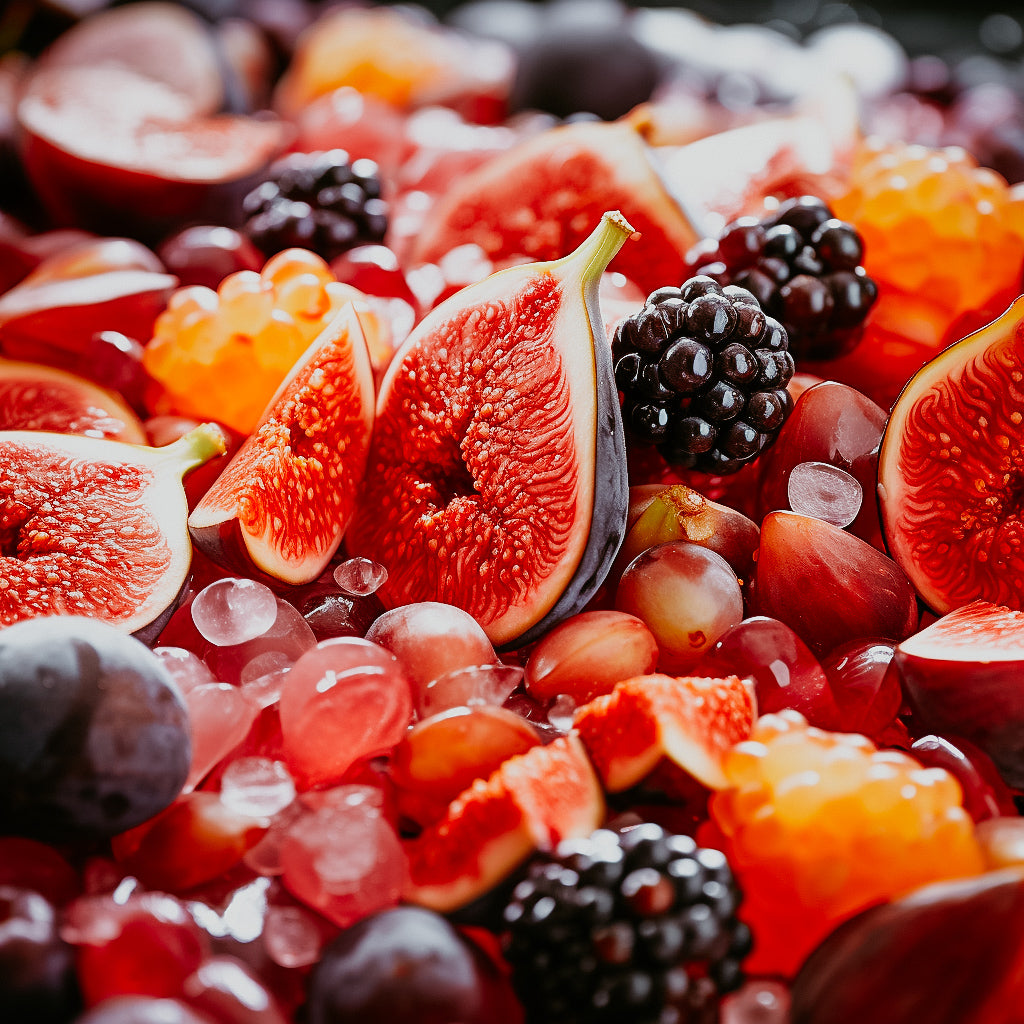 A close-up image of a variety of fresh fruits including figs, blackberries, and grapes, representing the natural scentscape of the Fruit Pulp fragrance oil.