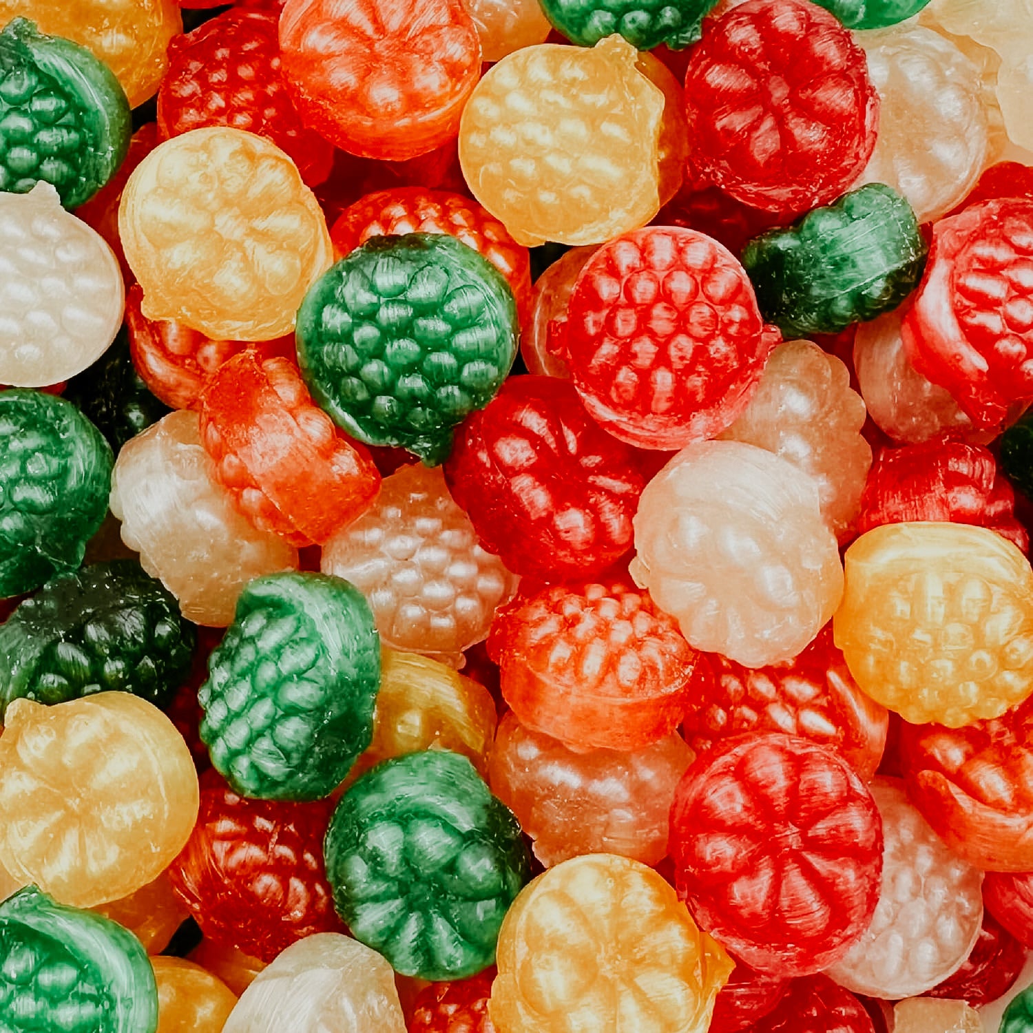 A colorful assortment of italian hard candies with a variety of fruit flavors.