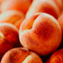 Close-up of peaches with a soft focus on texture and color.