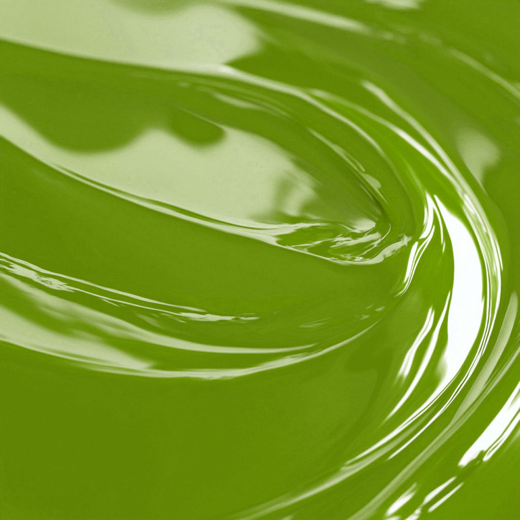 Close-up view of a green liquid candle dye.