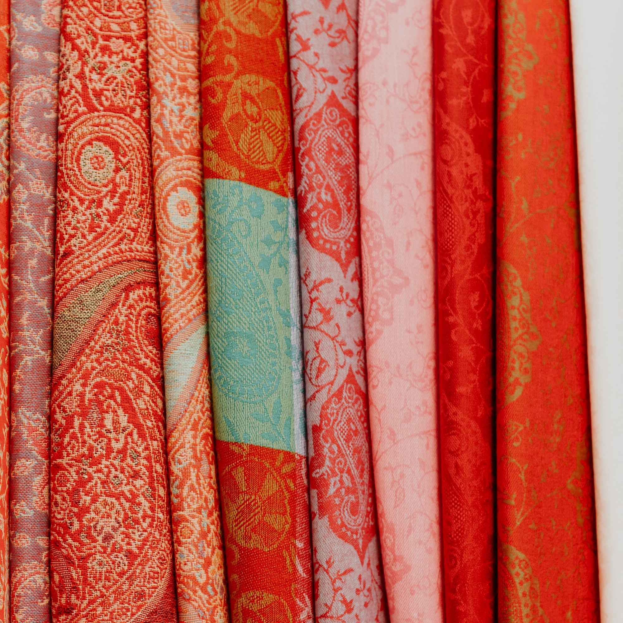 a photo of various colored pashmina scarves