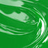 Close-up view of a fluorescent green liquid candle dye.