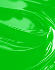 A close-up image of a highly concentrated lime green liquid candle dye.