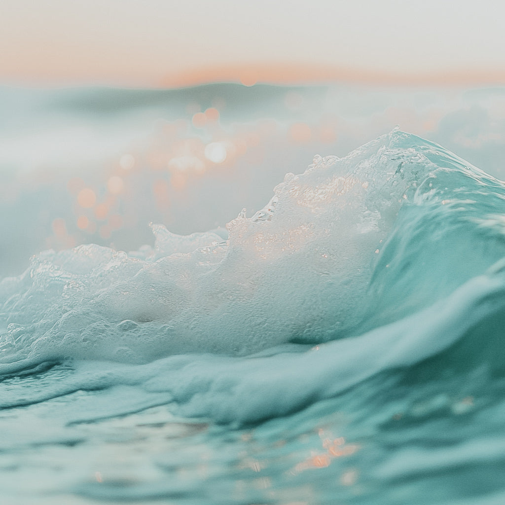 A close-up image of ocean waves with a serene coastal breeze theme.