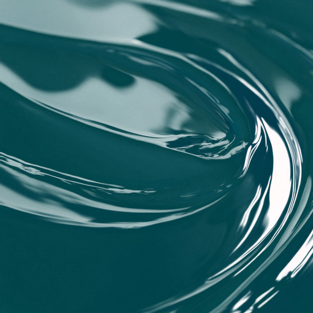 A close-up image of a teal-colored liquid candle dye.