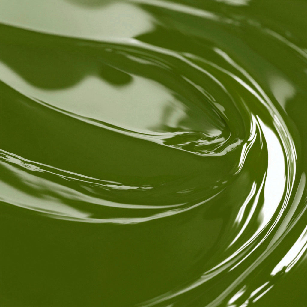 A close-up image of a olive green liquid candle dye.