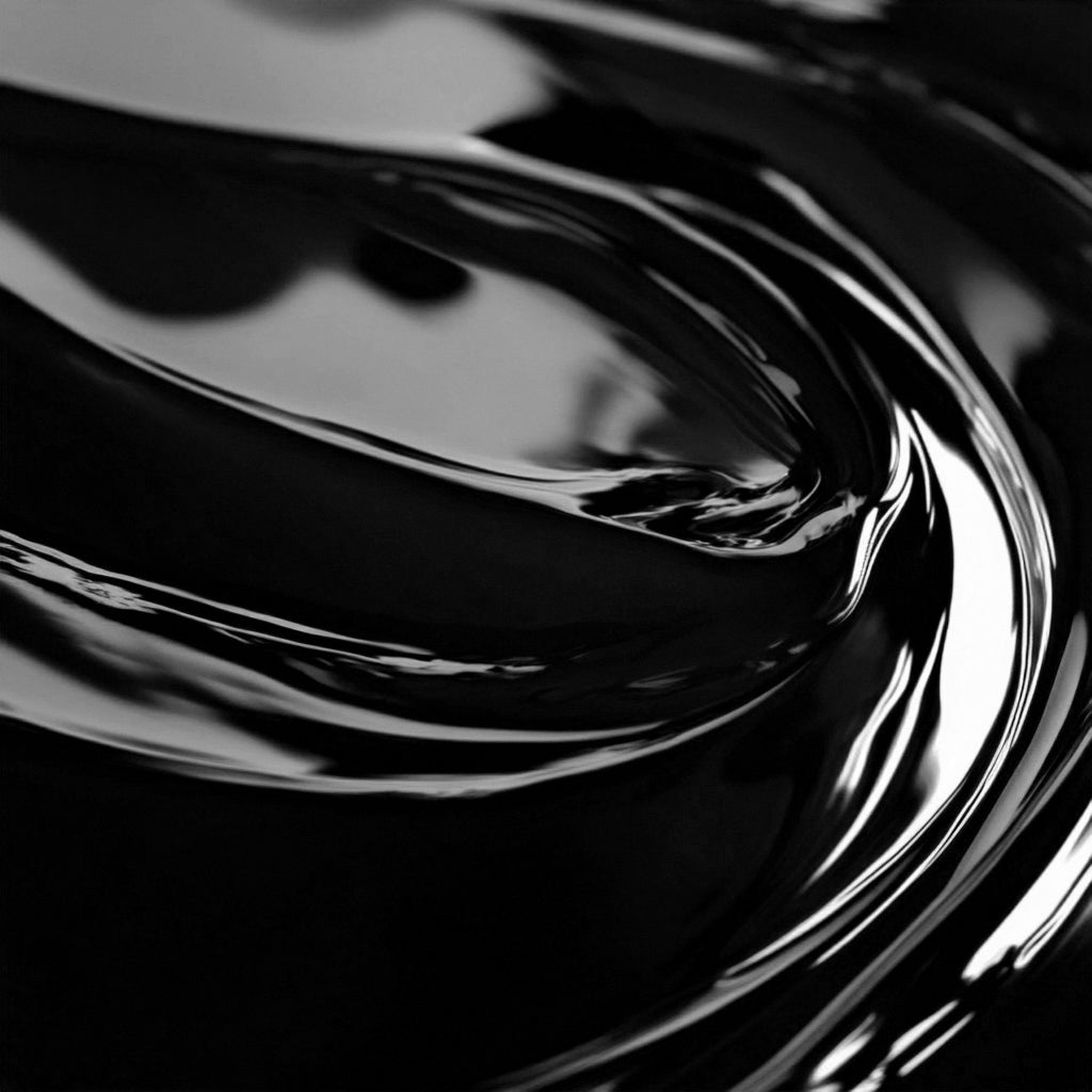 Close-up view of a highly concentrated black liquid candle dye.