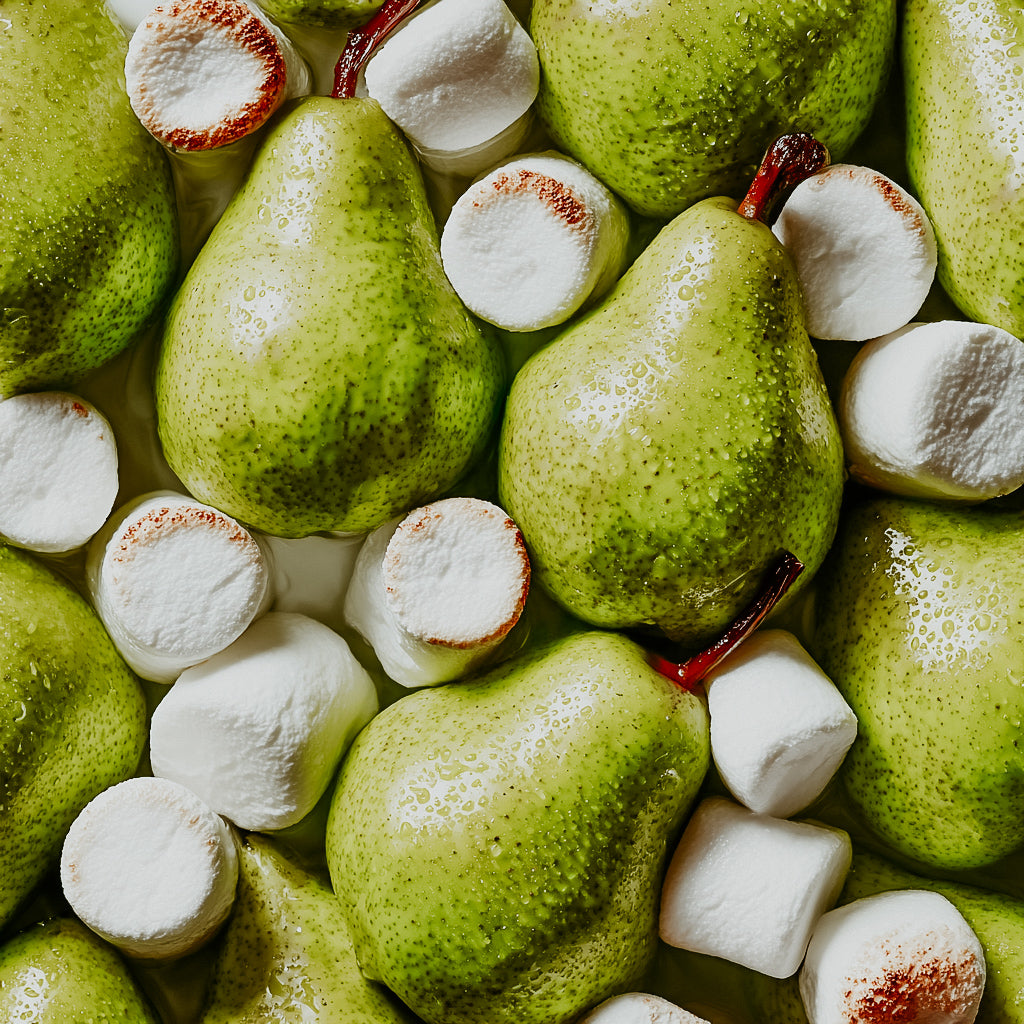 Green pears and white marshmallows arranged together