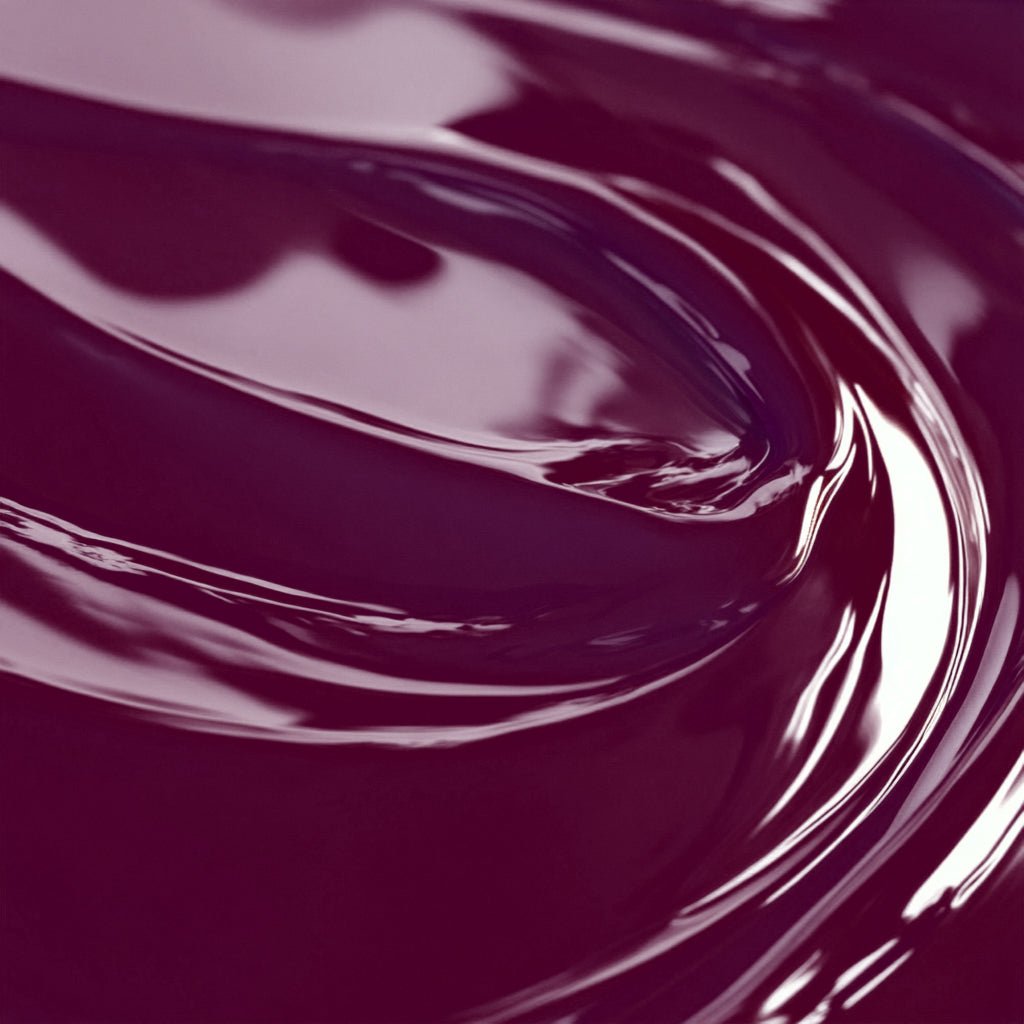 A close-up image of a highly concentrated purple liquid candle dye.
