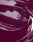 A close-up image of a highly concentrated purple liquid candle dye.