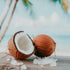 A image of a coconut and salt crystals on a wooden surface with a beach background.