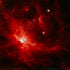 Red nebula with stars in a dark space background