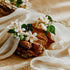 White flowers on a woven basket with beige fabric