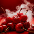 A bunch of red cherries with smoke coming from them, set against a red background, representing the fragrance oil.