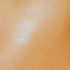 Close-up image of a person's skin, presumably to illustrate the softness achieved by using the fragrance oil.