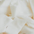 Chopped pieces of white soy-blend wax.