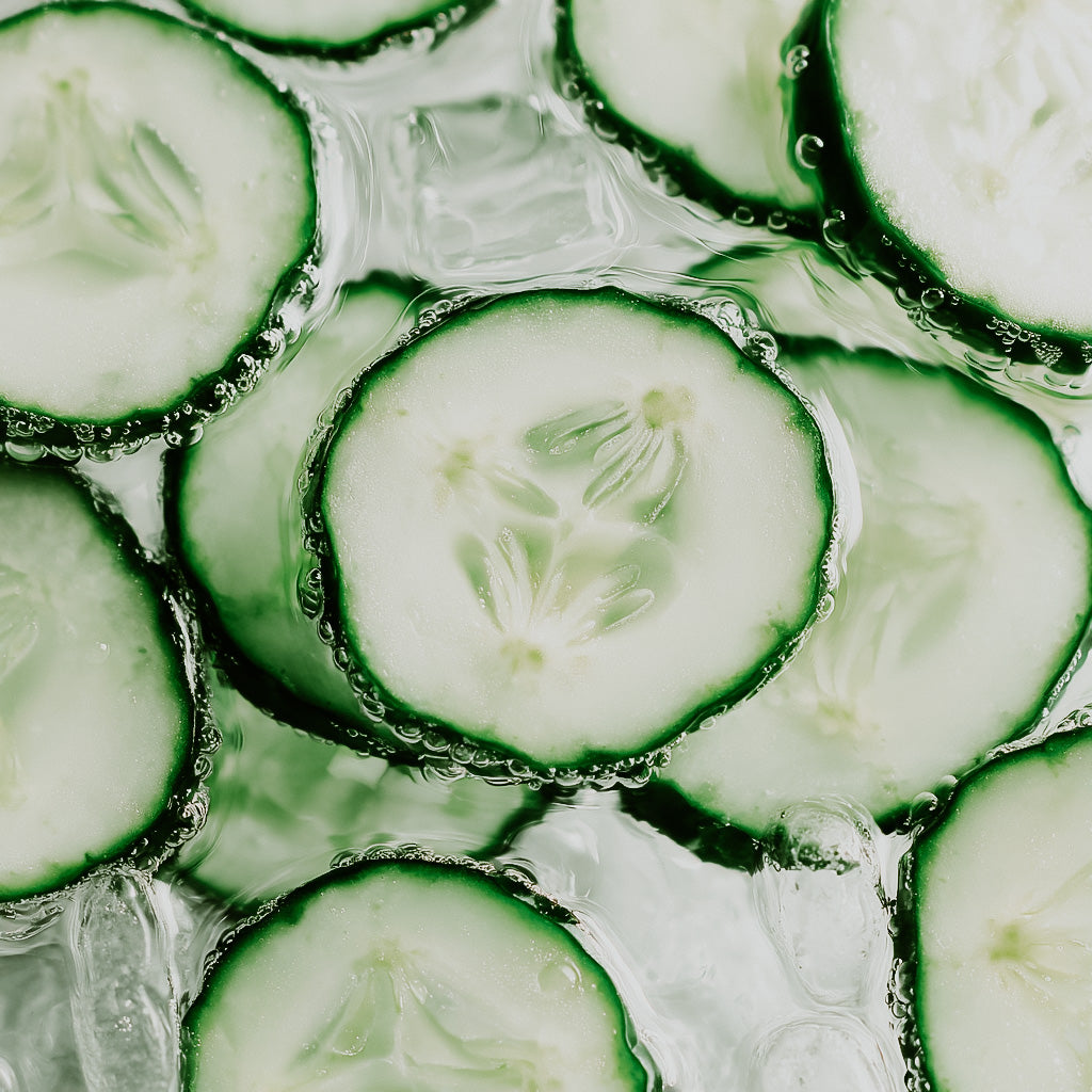 Close-up of sliced cucumbers in a water bath