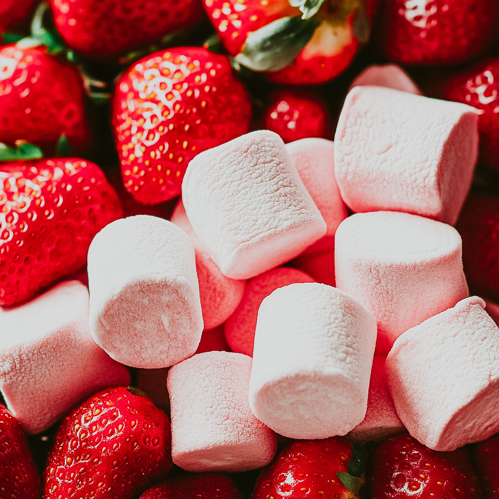 A close-up image of pink marshmallows and fresh strawberries, suggesting a sweet and fruity fragrance.