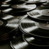 Stack of vinyl records with a close-up view