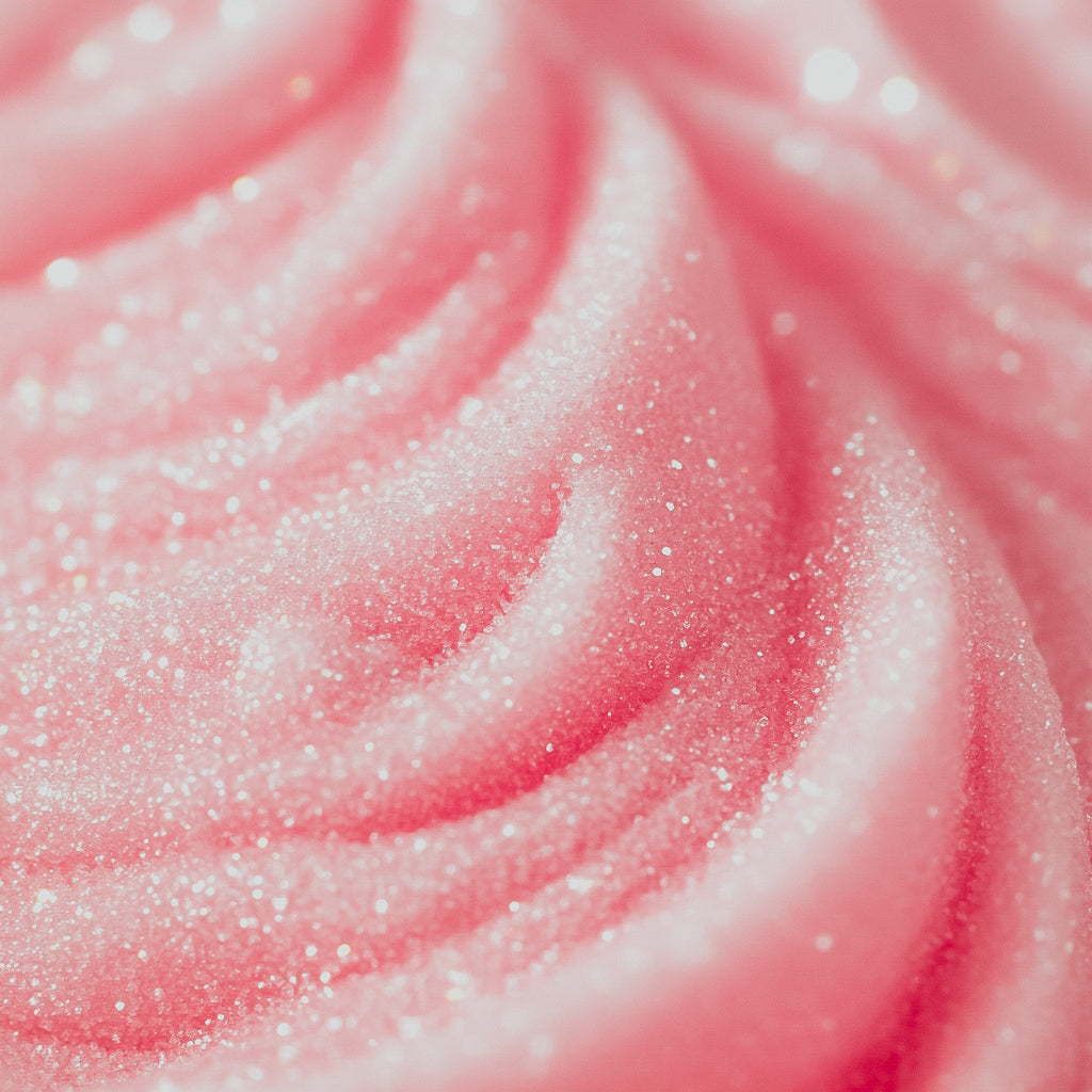 A close-up image of pink fluffy product with a glittery texture, likely representing the 'Whimsical Pink Sugar' fragrance oil.