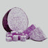 A purple taro root cut into cubes, isolated on a white background.